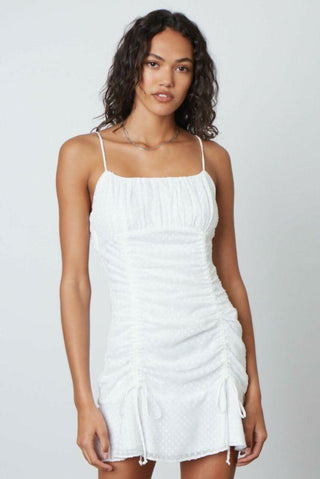 White ruched bodycon mini dress with ruffle hem