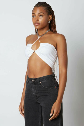 Side profile of a white bandeau-style halter top with adjustable neck ties