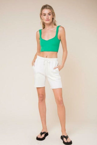 Emerald green sweetheart crop top with criss-cross low back for summer and resort style
