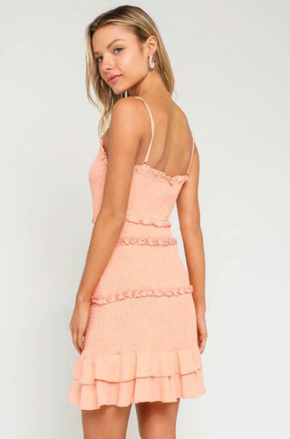 Back view of Rhea Peach Blush Smocked Mini Dress with spaghetti straps
