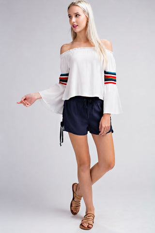 Model wearing the Playa Fest White Off-the-Shoulder Bell Sleeve Top