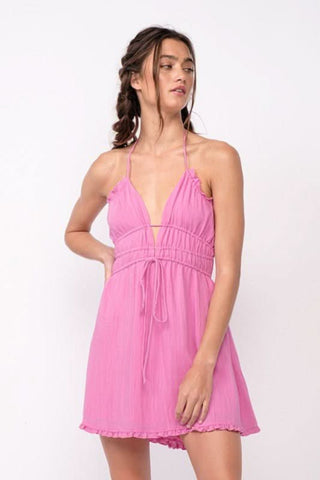 Front profile view of Kristen Pink Halter Mini Dress showing the smocked waist 