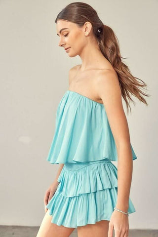 Milky blue strapless ruffle romper side view flowy silhouette
