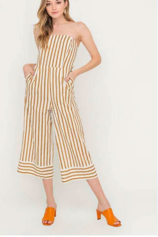 Molly Tan Striped Strapless Midi Jumpsuit styled with orange heels