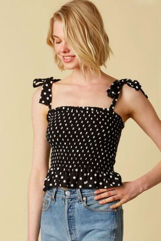 Black polka dot smocked peplum top front view