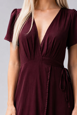 Front closeup of burgundy wrap dress