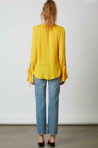 Yellow flounce sleeve wrap top back view