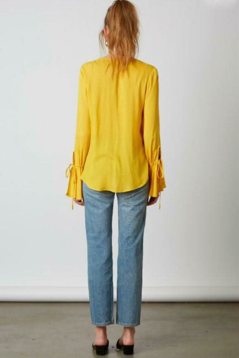 Yellow flounce sleeve wrap top back view